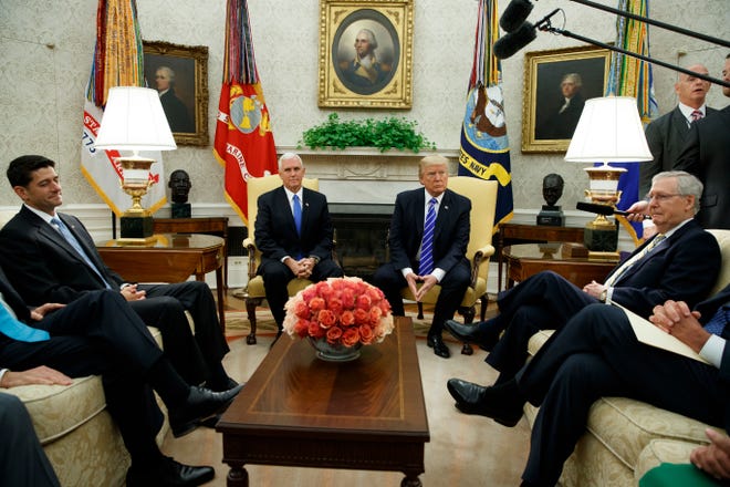 President Donald Trump pauses during a meeting with Congressional leaders in the Oval Office of the White House, Wednesday, Sept. 6, 2017, in Washington. From left, Speaker of the House Paul Ryan, R-Wis., Vice President Mike Pence, Trump, and Senate Majority Leader Mitch McConnell, R-Ky. (AP Photo/Evan Vucci)