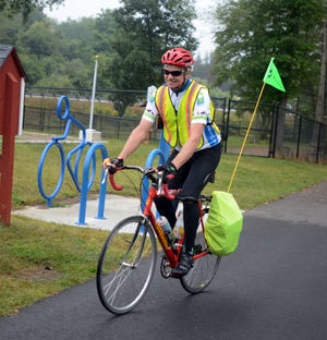 Rob Dexter, of West Hartford, begins his leg of the ride to Hartford during a stop in Putnam for the East Coast Greenway Alliance's East Coast River Relay. Another set of bicyclists will be taking the next leg of the ride in Hartford as the relay continues to Florida. [Aaron Flaum/NorwichBulletin.com]