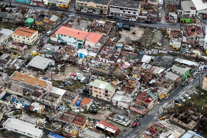 Storm damage in the aftermath of Hurricane Irma, in St. Maarten. Irma cut a path of devastation across the northern Caribbean, leaving thousands homeless after destroying buildings and uprooting trees. Significant damage was reported on the island that is split between French and Dutch control. (Gerben Van Es/Dutch Defense Ministry via AP)