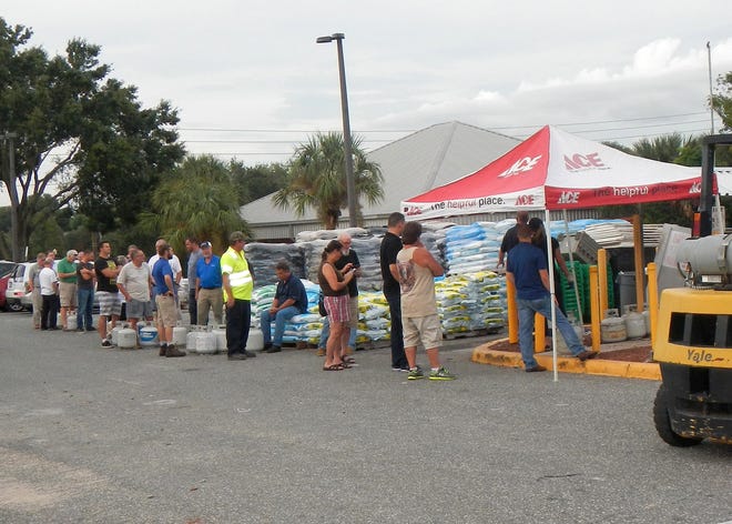 Lake County residents lined up at Ace Hardware Tuesday in Clermont to refill their propane tanks. [LINDA CHARLTON / CORRESPONDENT]