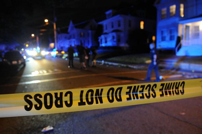 A July 2017 file photo shows Brockton police investigating a shooting in the city.