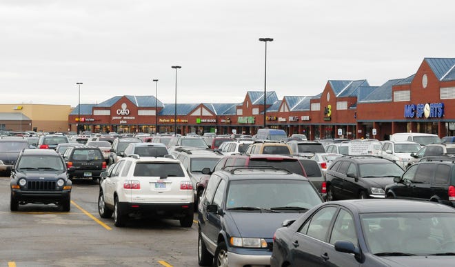 Vehicles sit in a parking lot. [Sentinel file photo]