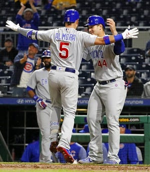Chicago Cubs' Albert Almora Jr. (5) celebrates with Anthony Rizzo (44) after hitting a two-run home run off Pittsburgh Pirates relief pitcher Angel Sanchez in the seventh inning of a baseball game, Thursday, Sept. 7, 2017 in Pittsburgh. (AP Photo/Gene J. Puskar)
