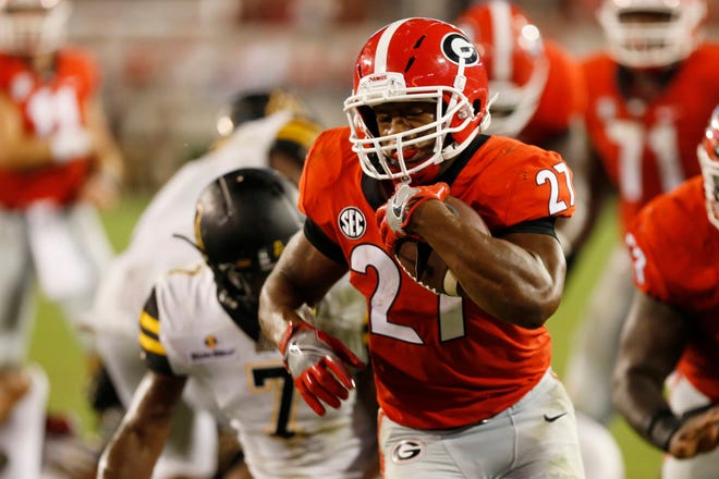 Georgia tailback Nick Chubb (27) drives in for a touchdown in the second half of an NCAA college football game between Georgia and Appalachian State in Athens, Ga., Saturday, Sept. 2, 2017. (Photo/Joshua L. Jones, Athens Banner-Herald)
