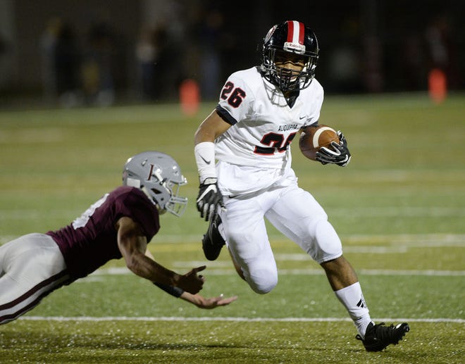 Aliquippa's Xavier Harvey escapes Beaver's Nik Rowse during Friday night's game at Beaver Area High School.