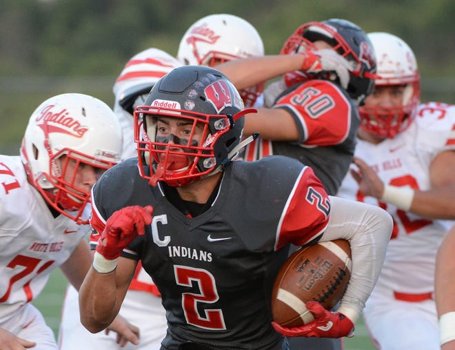 West Allegheny running back Will Weber (2)  finds a hole against North Hills in the first quarter Friday at West Allegheny High School. Weber later scored the winning touchdown and two-point conversion in West A's 29-28 win.
