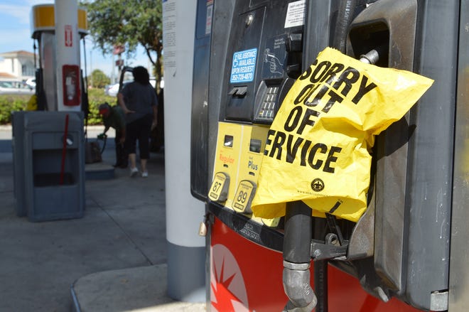 Plastic bags cover the gas pumps on Thursday, Sept. 7, 2017, at the Circle K/Shell station at the corner of W. Dixie Avenue and U.S. Highway 27 in Leesburg, Fla. [Whitney Lehnecker / Daily Commercial]