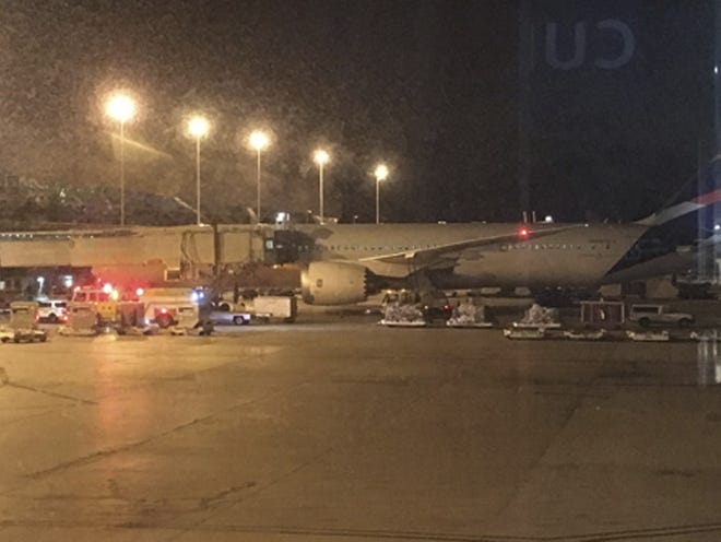 This photo provided by Shawn Woodward shows the scene on the tarmac at the Miami Airport, Thursday, Sept. 7, 2017. Police said they were investigating an officer-involved shooting Thursday night at the Miami airport that shut down a terminal as people looked to leave Florida ahead of Hurricane Irma. Police said in a statement that they were responding, but no other details were immediately available. (Shawn Woodward via AP)