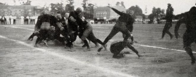 An image of the Gator football team playing on Fleming Field from the University of Florida yearbook. [Photo courtesy of the Matheson History Museum]