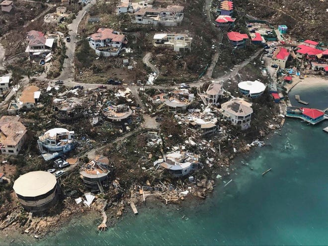 This photo provided by Caribbean Buzz shows the destruction left in the wake of Hurricane Irma Friday, Sept. 8, 2017, in the U.S. Virgin Islands The death toll from Hurricane Irma has risen to 22 as the storm continues its destructive path through the Caribbean. The dead include 11 on St. Martin and St. Barts, four in the U.S. Virgin Islands and four in the British Virgin Islands. There was also one each in Barbuda, Anguilla, and Barbados. The toll is expected to rise as rescuers reach some of the hardest-hit areas. (Caribbean Buzz via AP)
