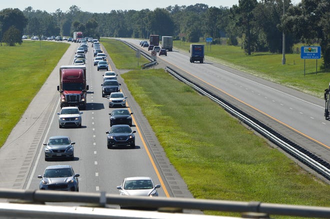 Traffic was backed up for miles along the northbound lanes of the Florida Turnpike in Lake and Sumter counties as south Florida residents fled ahead of Hurricane Irma on Thursday, Sept. 7, 2017. [Whitney Lehnecker / Daily Commercial]