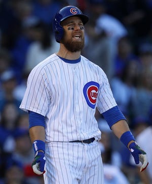 Chicago Cubs' Ben Zobrist reacts after a called strike during the fourth inning of Saturday's game against the Milwaukee Brewers in Chicago. [AP Photo/Jim Young]