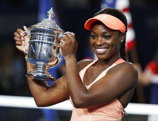 Sloane Stephens holds up the championship trophy after beating Madison Keys in the U.S. Open final on Saturday.