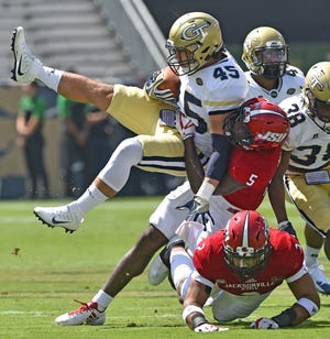 Georgia Tech's T.D. Roof is tackled by Jacksonville State's Siran Neal during Saturday's game in Atlanta. Visit gadsdentimes.com to view a photo gallery from the game. [Dave Hyatt/The Gadsden Times]