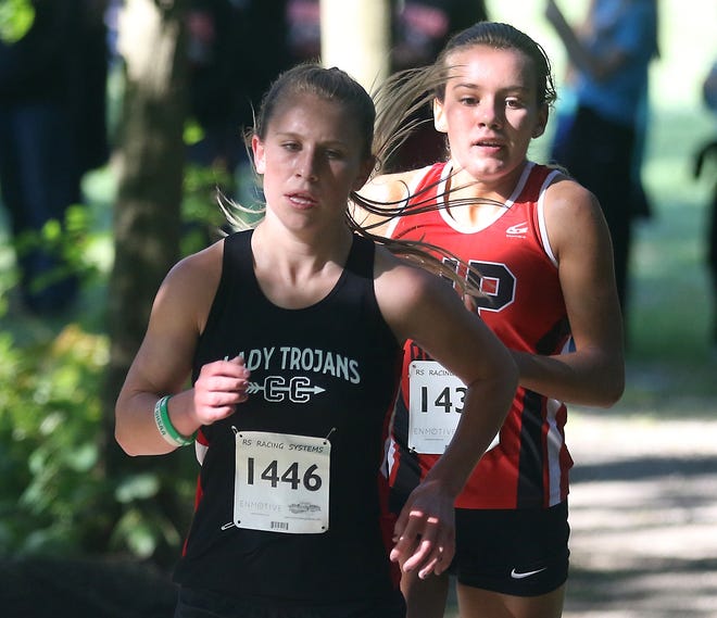 Madi DeBos of Tuscarawas Valley and Rachel Anderson of New Philadelphia finish first and second in the large school division of the Dover Cross Country Invitational Saturday. (TimesReporter.com / Jim Cummings)