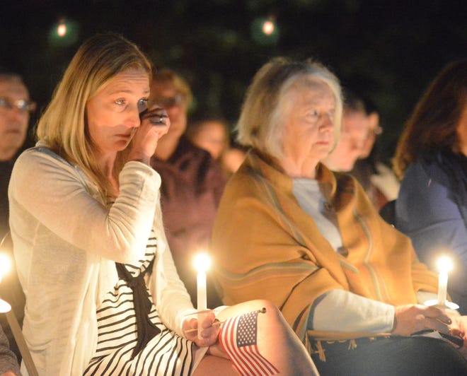 Tara Bane (left), who lost her husband Michael Bane in the Sept. 11 attacks, and Grace Godshalk, who lost her son William Godshalk in the attacks, attend a candlelight service to honor the 9/11 victims at the Garden of Reflection 9/11 Memorial in Lower Makefield on Sunday, Sept. 10, 2017.