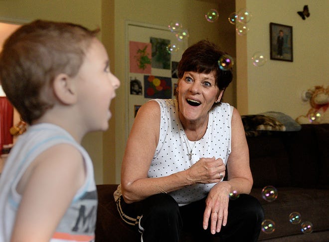 Karen Bound and her grandson, Cameron, 2, play with bubbles in their Bristol Township home on Saturday, Aug. 12, 2017. Bound is Cameron's legal guardian. A growing number of grandparents are their grandchildren's legal guardians.