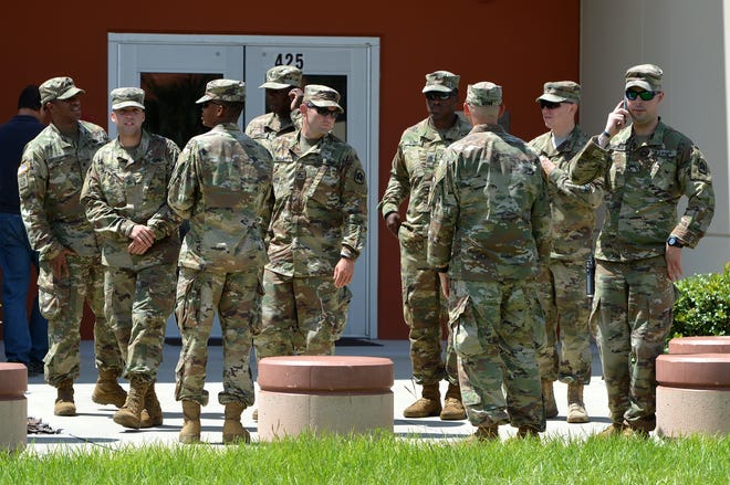 About 72 soldiers with the National Guard's HHB 3-265th Air Defense Artillery from Sarasota arrived at the Lake County Emergency Management and Communications Center in Tavares on Friday. [WHITNEY LEHNECKER / DAILY COMMERCIAL]