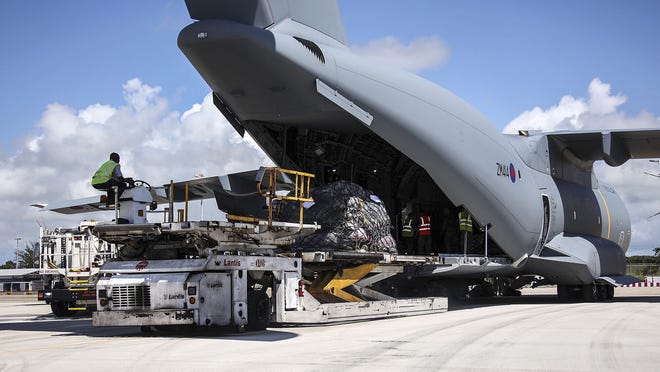 In this undated photo provided on Sunday Sept. 10, 2017, by the British Ministry of Defence, the RAF A400M arrives on the British Virgin Islands to provide humanitarian assistance to British overseas territories. The death toll from Hurricane Irma has risen to 22 as the storm continues its destructive path through the Caribbean. (Joel Rouse/MOD via AP)
