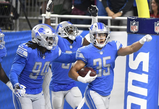 Detroit Lions strong safety Miles Killebrew (35) celebrates his 35-yard interception for a touchdown against the Arizona Cardinals during an NFL football game in Detroit, Sunday, Sept. 10, 2017. Detroit won 35-23. (AP Photo/Jose Juarez)