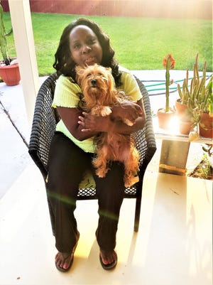 Nazaline McInnis, formerly of New York, now lives in Lubbock. She is shown with her dog, Bailey. (Provided by Nazaline McInnis)