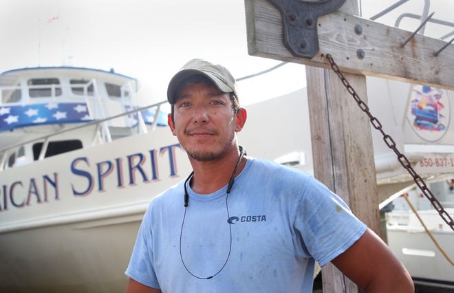 Bill Harrison is first mate aboard the New Florida Girl's American Spirit that docks behind AJ's Seafood and Oyster Bar. [MICHAEL SNYDER/THE LOG]