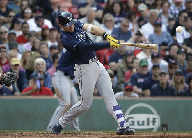 Tampa Bay Rays' Evan Longoria hits an RBI single off a pitch by Boston Red Sox's Rick Porcello in the fifth inning of a baseball game, Sunday, Sept. 10, 2017, in Boston. (AP Photo/Steven Senne)