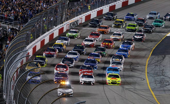 The field does a four-wide warmup loop prior to the start of the NASCAR Cup Series auto race at Richmond International Raceway in Richmond, Va., on Saturday. (AP Photo/Steve Helber)
