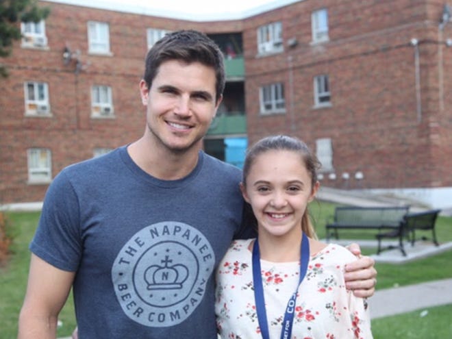 SUBMITTED PHOTO

Actor Robbie Amell and Uhrichsville's Breanna Taylor pose together during a break from filming his movie "Code 8."