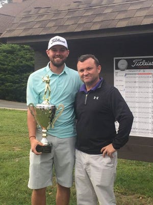 Dylan Jones, left, poses with the trophy Sunday at Crooked Creek Golf Club after winning the Apple Jack Amateur Championship. At right is Crooked Creek's Tommy Laughter.