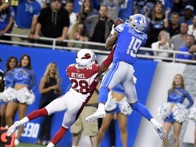Detroit Lions rookie receiver Kenny Golladay catches a 10-yard touchdown as Arizona Cardinals cornerback Justin Bethel defends in Detroit on Sunday. [JOHN JUAREZ/AP PHOTO]