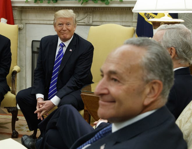 In this Sept. 6, 2017 photo, President Donald Trump and Senate Minority Leader Chuck Schumer, D-N.Y., during a meeting with other Congressional leaders in the Oval Office of the White House in Washington. Trump's deal with Democrats has offered a glimpse of the president's interest in governing as an independent, unbound by ideology despite his takeover of the Republican Party last year. (AP Photo/Evan Vucci)