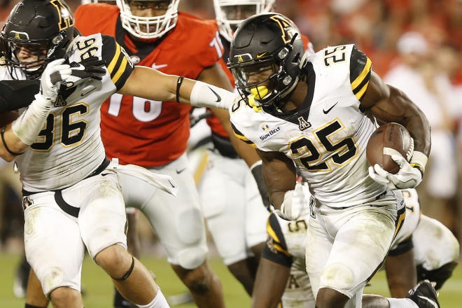 Appalachian State running back Jalin Moore (25) carries against Georgia during the second half of an NCAA college football game Saturday, Sept. 2, 2017, in Athens, Ga. Georgia won 31-10. (Joshua L. Jones/Athens Banner-Herald via AP)