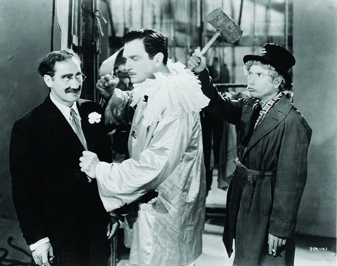 Groucho Marx, Walter Woolf King and Harpo Marx in a scene from "A Night at the Opera." [Courtesy photo Warner Bros.]