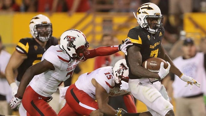 Running back Kalen Ballage of Arizona State runs for a 75-yard touchdown against Texas Tech last season. The TD was one of eight Ballage scored against the Red Raiders in ASU’s 68-55 victory. The teams face off again Saturday night in Lubbock. CREDIT: Christian Petersen/Getty Images