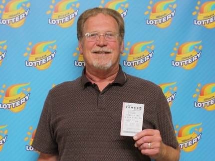 David Marques of Mount Zion with his winning ticket. Courtesy of Illinois Lottery.