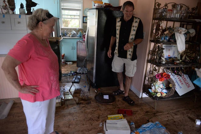 Betty Jo and Wayne Smeltzer stand in the living room of their Lewis Avenue home on Tybee Island on Wednesday, Sept. 13, 2017. The Smeltzers’ home flooded when Lewis Avenue was inundated from both directions by water during high tide on Monday, which was amplified by effects from the powerful storm Irma. The couple had just finished fixing their home from last year’s Hurricane Matthew. (Dash Coleman/Savannah Morning News)