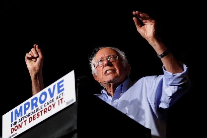 In this July 9, 2017 photo, Sen. Bernie Sanders, I-Vt., speaks during a "Care Not Cuts" rally in support of the Affordable Care Act in Covington, Ky. House Minority Leader Nancy Pelosi is declining to endorse Sen. Bernie Sanders' universal health care bill saying that while she has long supported the idea the bill captures, of everybody getting health coverage, "Right now I'm protecting the Affordable Care Act." (AP Photo/John Minchillo)