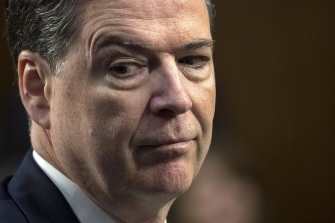 In this June 8, 2017 photo, former FBI director James Comey testifies before the Senate Select Committee on Intelligence, on Capitol Hill in Washington. The Republican attacks on fired FBI Director James Comey have sharply intensified in the last two weeks, with broadsides delivered on Twitter, public statements and even from the White House podium. (AP Photo/J. Scott Applewhite)
