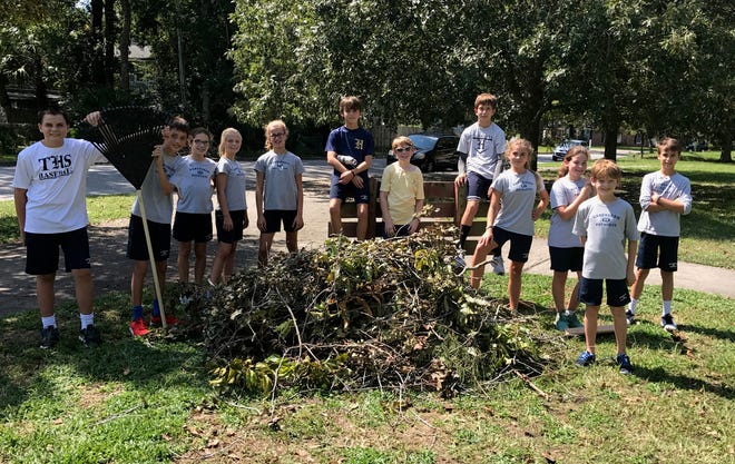 At The Habersham School, Coach Bailey Hillis' physical education classes clean up debris in adjacent Hull Park following Hurricane Irma. (Photo courtesy of The Habersham School)
