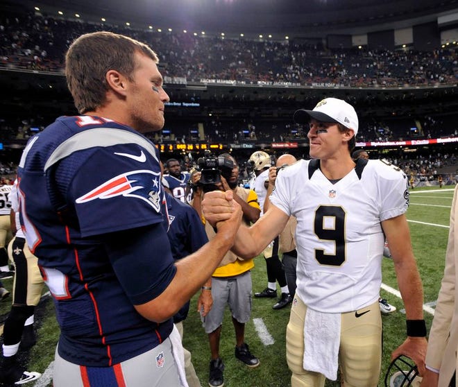 In this Aug. 22, 2015, file photo, New England Patriots quarterback Tom Brady, left, greets New Orleans Saints quarterback Drew Brees after an NFL preseason football game in New Orleans. The Patriots and the Saints meet Sunday, Sept. 17, in New Orleans.