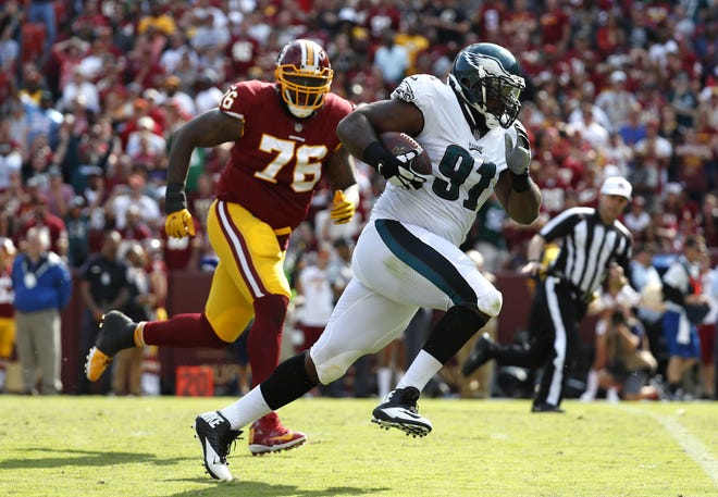 (File) Eagles defensive tackle Fletcher Cox (91) returns a fumble 20 yards for a touchdown during the fourth quarter of a 30-17 Week 1 win over Washington.