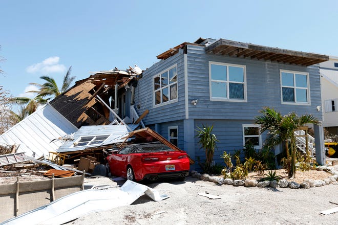 In this Sept. 13, 2017, photo, a house with its roof blown off by Hurricane Irma in Summerland Key, in the Florida Keys. Rising sea levels and fierce storms have failed to stop relentless population growth along U.S. coasts in recent years, a new Associated Press analysis shows. The latest punishing hurricanes scored bull’s-eyes on two of the country’s fastest growing regions: coastal Texas around Houston and resort areas of southwest Florida. (AP Photo/Wilfredo Lee)