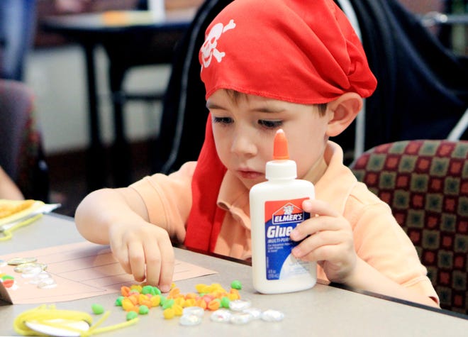 Jaxon Williams works on crafting a pirate chest Friday, Sept. 15, 2017, during the Pirate Party and Storytime at the Miller Branch Library. Young pirates were treated to stories, crafts and snacks tied to a pirate theme. Jaxon is the 4-year-old son of Becky and James Williams. [JAMIE MITCHELL/TIMES RECORD]