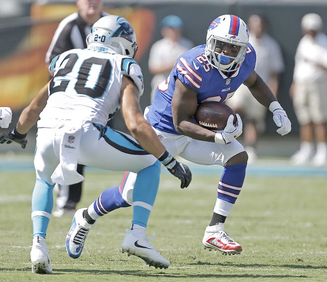 Buffalo Bill LeSean McCoy (right) tries to run past Carolina Panther Kurt Coleman during the second half of Sunday's game in Charlotte, North Carolina.       

[Bob Leverone / Associated Press]