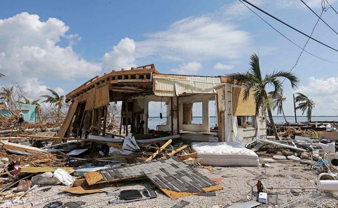 Debris surrounds a destroyed structure in the aftermath of Hurricane Irma on Big Pine Key, Fla.