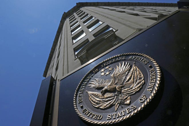 In this June 21, 2013, file photo, the seal affixed to the front of the Department of Veterans Affairs building in Washington. A new first-of-its kind government study finds suicide among military veterans is especially high in the western U.S. and rural areas. The numbers suggest that social isolation, gun ownership and limited health care access may be factors behind the higher numbers. The Department of Veterans Affairs released data Sept. 15, on suicide by state. (AP Photo/Charles Dharapak, File)