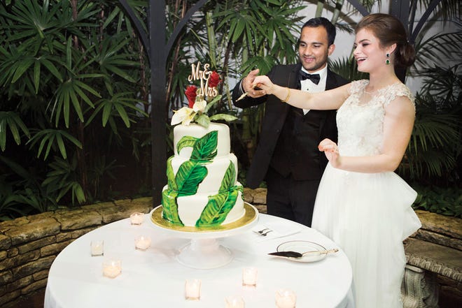 Julie and Manjul Bhusal Sharma's cake fit their tropical wedding theme, with passionfruit and mango fillings.