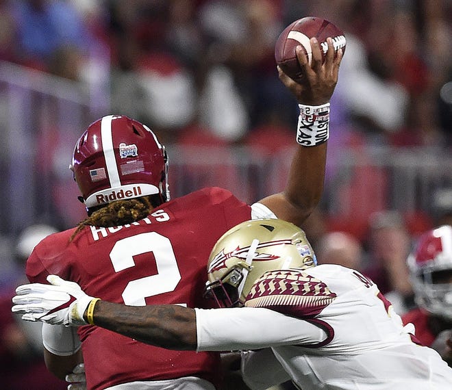 Florida State defensive back Derwin James (3) hits Alabama quarterback Jalen Hurts (2) during the first half of a game on Sept. 2 in Atlanta. No. 12 Florida State finally has a game to prepare for this week after not playing the previous two weeks due to Hurricane Irma. [AP Photo / Mike Stewart, File]