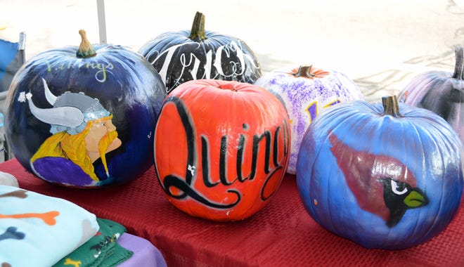 Inmates at Lakeland Prison painted pumpkins to raise money for the Refurbished Pets of Southern Michigan dog training program at the prison.